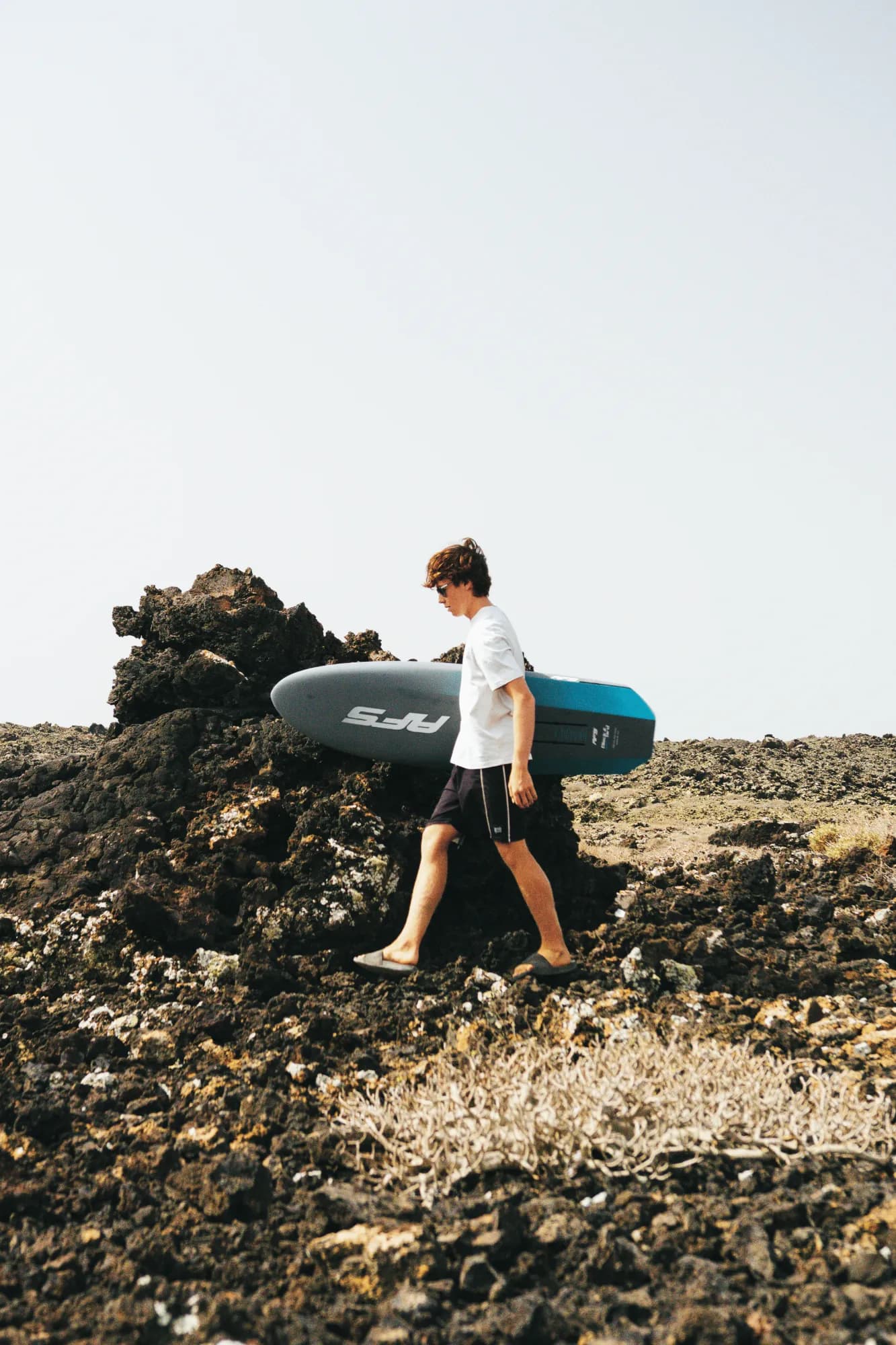 Rider walking on volcanic rock with a Blackbird Mid Length